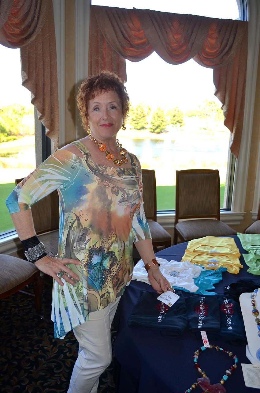 Heart's Desire jewelry owner Vicki Rollo shows off her jewelry.