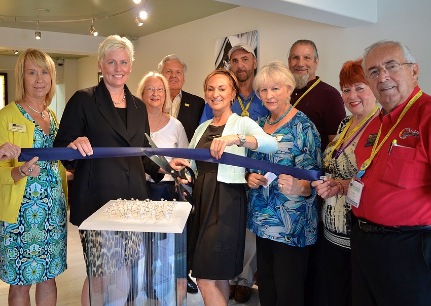 Adora Thompson and Tina Taylor Little cut the ribbon.