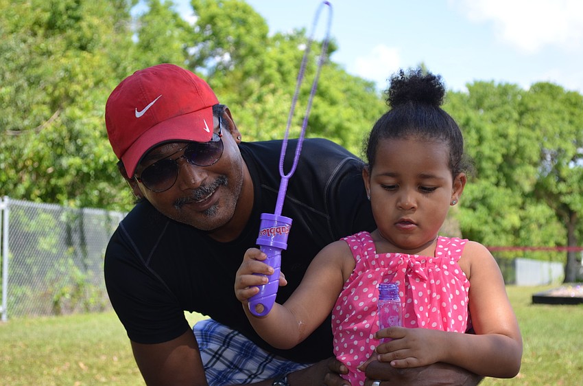 Francis and Cici Moss take a break from blowing bubbles.