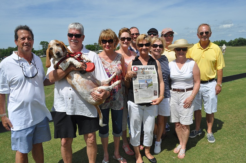 Vanessa Baugh (center, holding newspaper), the District 5 Manatee County commissioner, took in the action with friends.