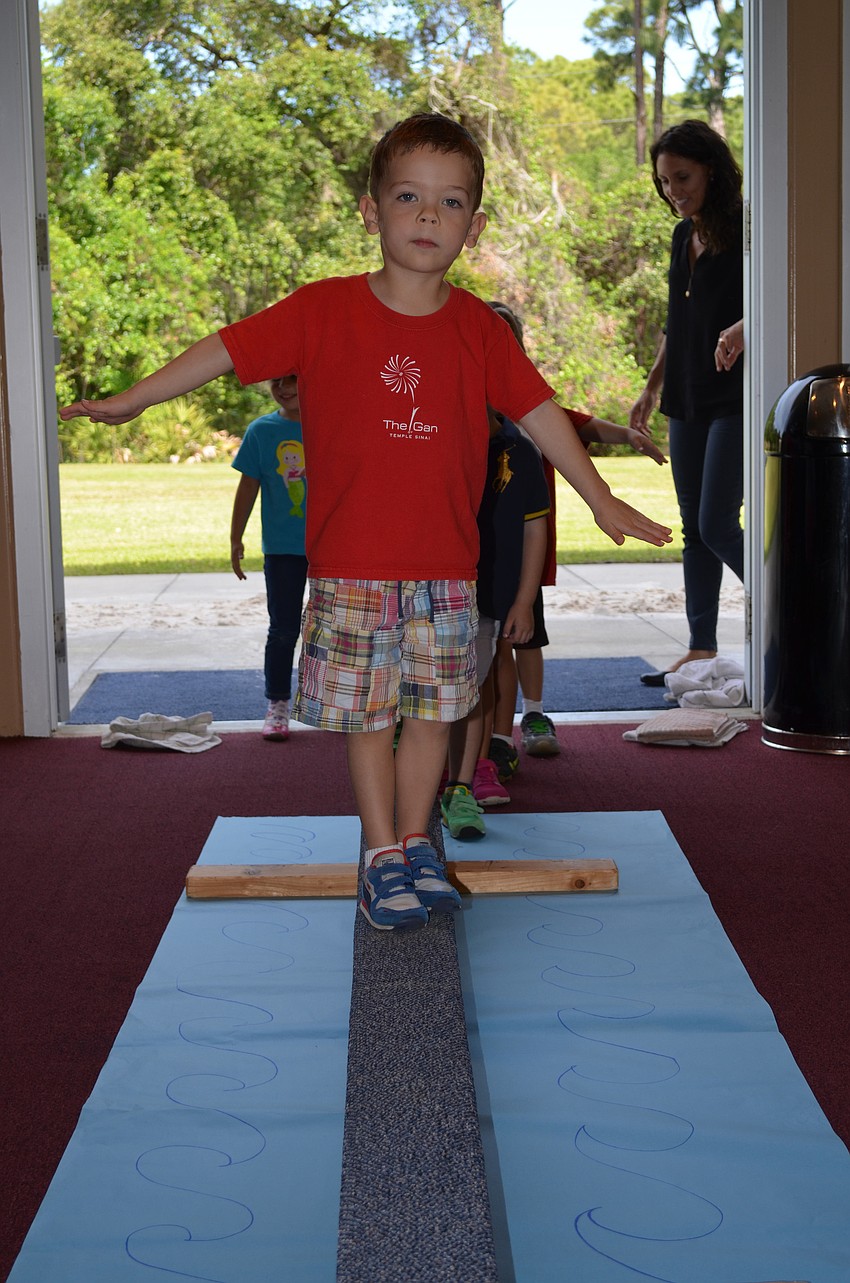 Teak Gammaro walks through the parted sea.
