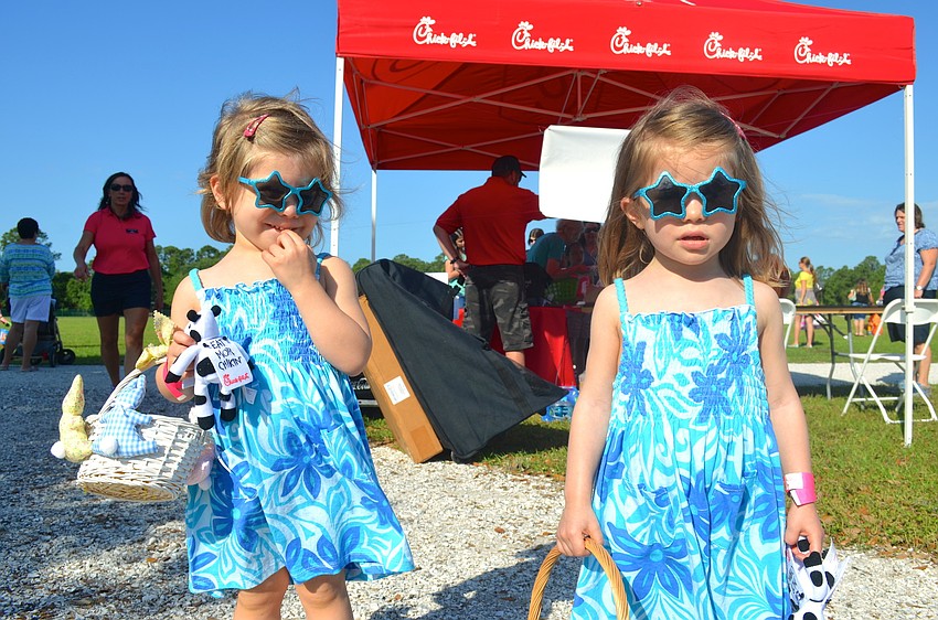 Three-year-old twins Kaya and Kenley Webb sport matching outfits.
