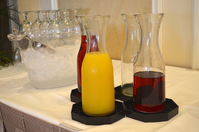 Orange juice, bacon and eggs, and other breakfast items fill the event.