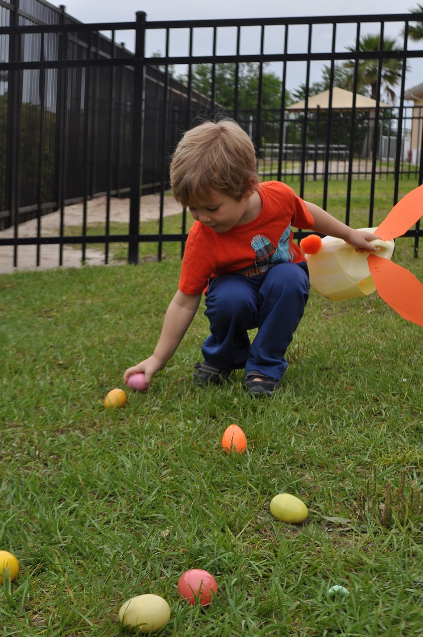 E.J. Teallow grabs eggs as quickly as possible.