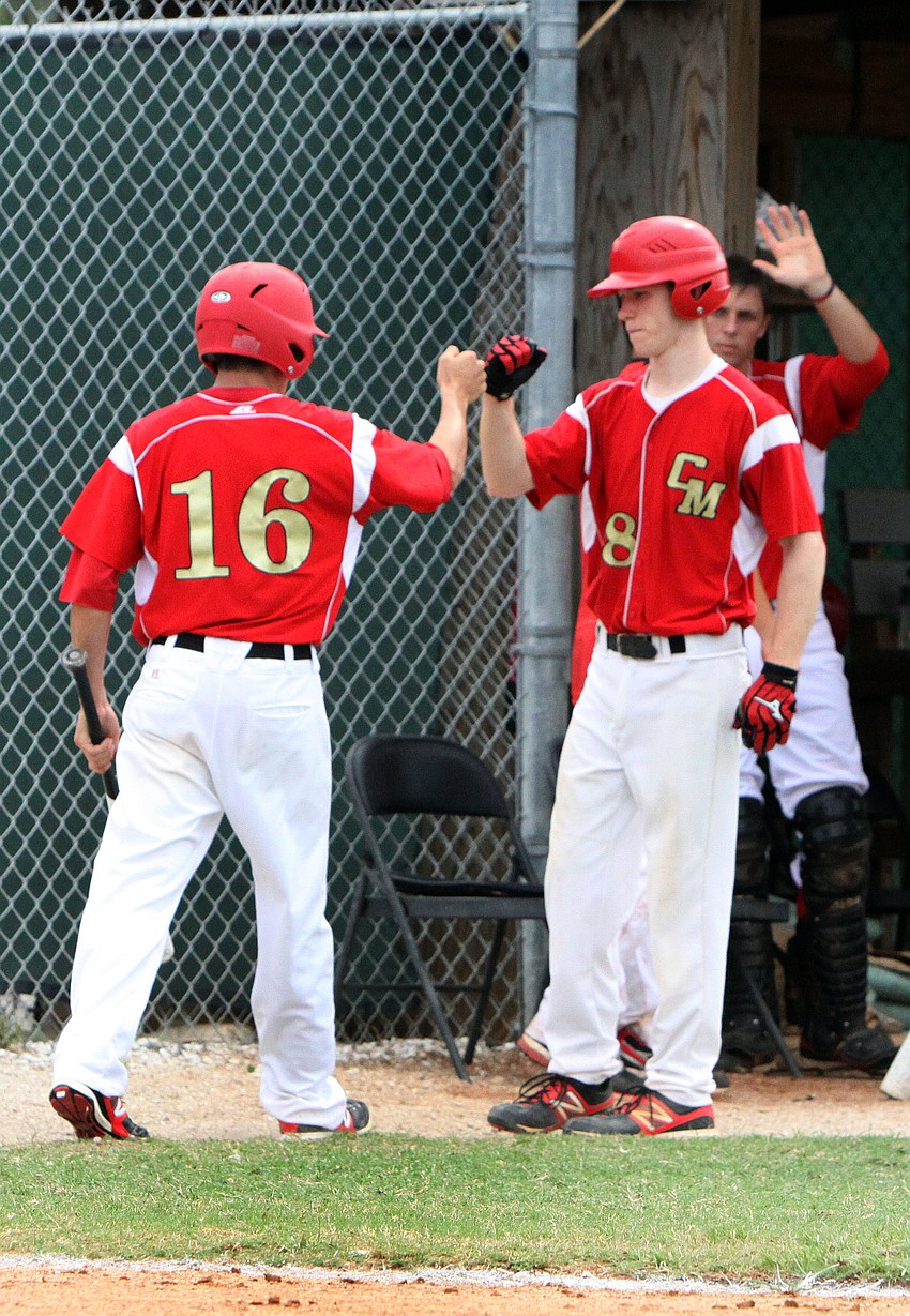Cardinal Mooneyâ€™s Beau Billings, No. 8, fist bumps with teammate Matt Quinlan, No. 16, after Quinlan got home.