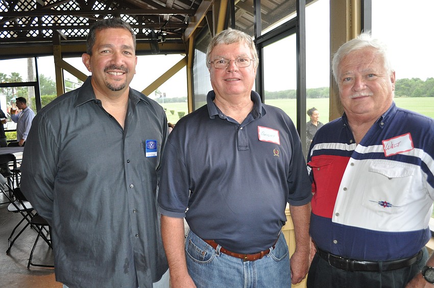 Lakewood Ranch Kiwanis Club President Andres Rincon with Dwight Gilmore and Walt Boyer