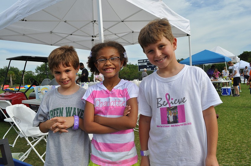 Drew Hill, Charlotte Blake and Giovanni Giuliani helped set up a booth and painted faces.