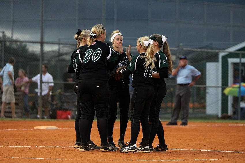 Lakewood Ranchâ€™s infielders meet on the mound.