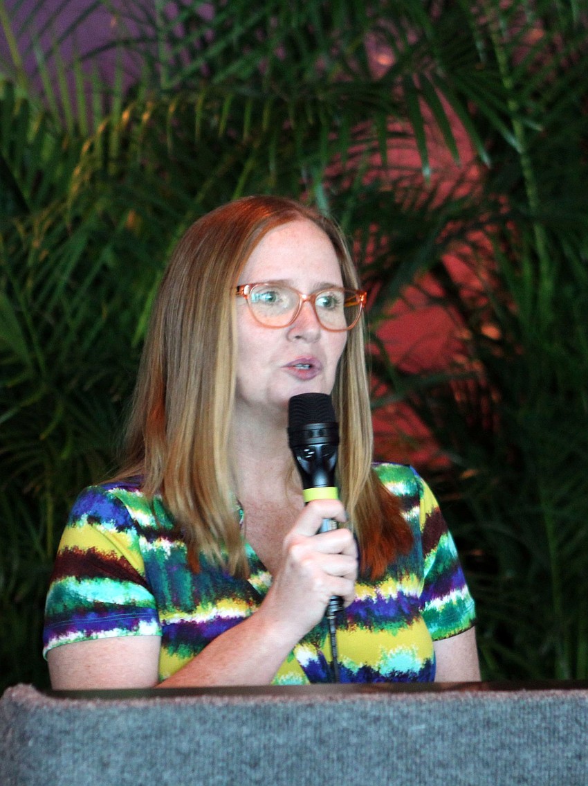 Jennifer Bement welcomes the graduates, families, sponsors and friends of Southeastern Guide Dogs to the 218th graduation ceremony.