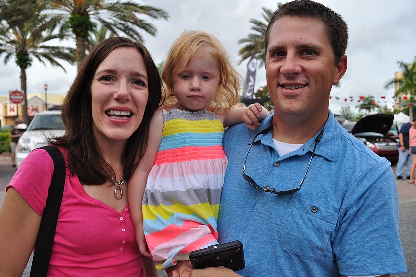 Amanda and Mark Kowalski, of Sarasota, brought their daughter, Grace, center.