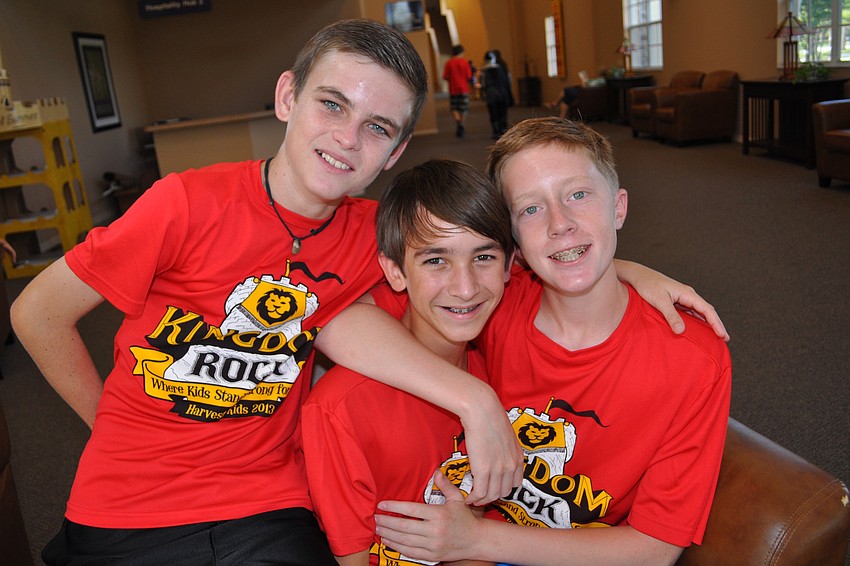 Kyle Wray, Jordan Conelias and Alez Dietz serve as volunteers for the week.