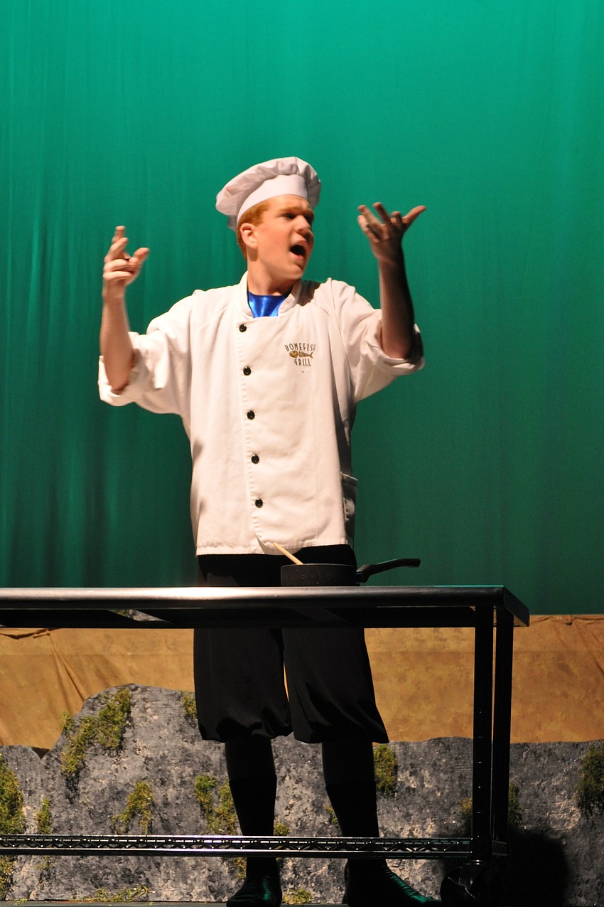 A gleeful Danny Shevlin, as a chef, sings about his love for crab and other seafood.