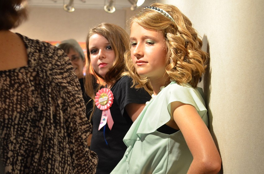 Designer Sylvie Howard talks to the judges about her design that Mikiah Dixon wears