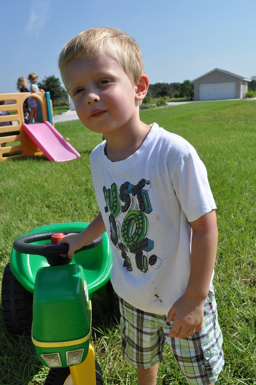 Colton Searcy plays outside.