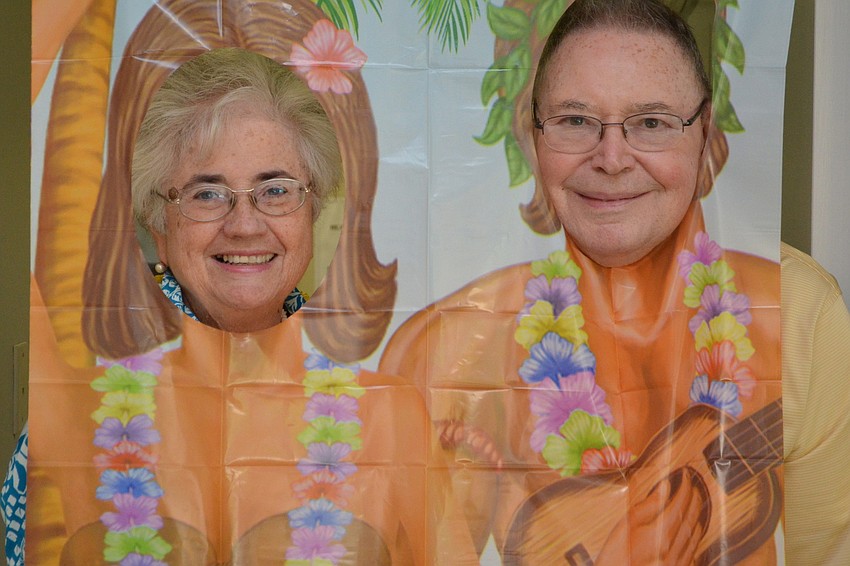 Ellen Roderick and Gene McLoone having a great time at the luau.