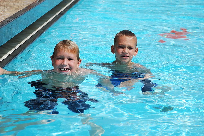 Dylan Elder, 7, and Braden Sullivan, 7, cooled off in the pool.