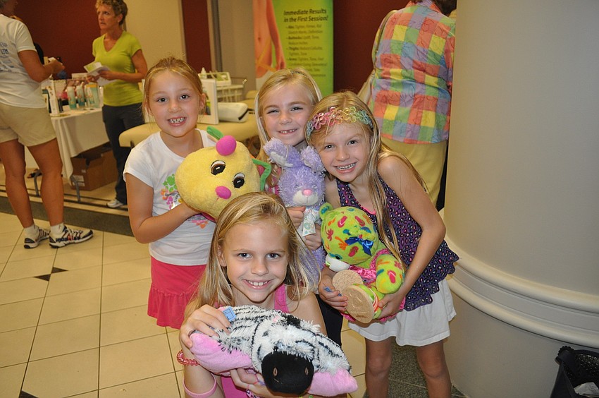 Madison Adams, Emma and Mia Jordan and Savannah Adams with their fuzzy friends