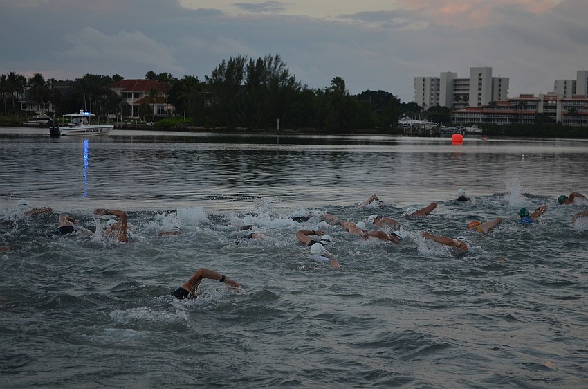Triathletes swim in the Longboat Key Triathlon.