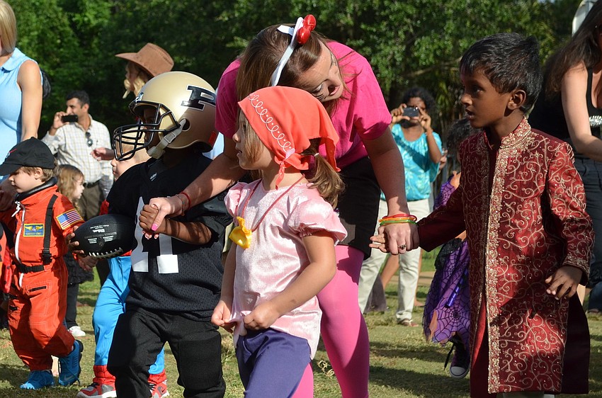 Teachers and students at Primrose School walk in the 9th annual Costume Parade.