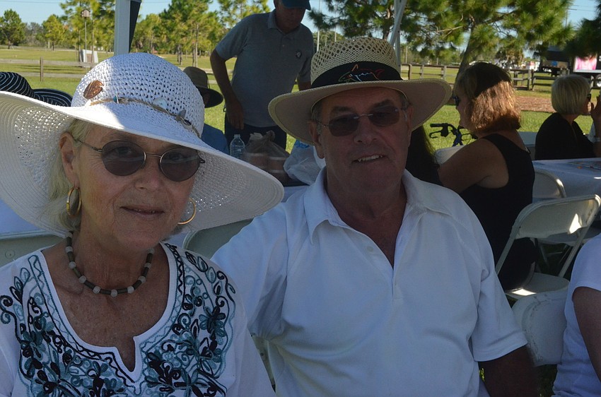Alex and Bob Mezger sit in the shade