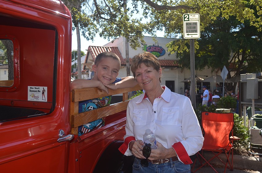 Aiden Templeton, with grandmother Winkie Angles, sits in the back of his grandfather's 1931 Ford Model A pick up