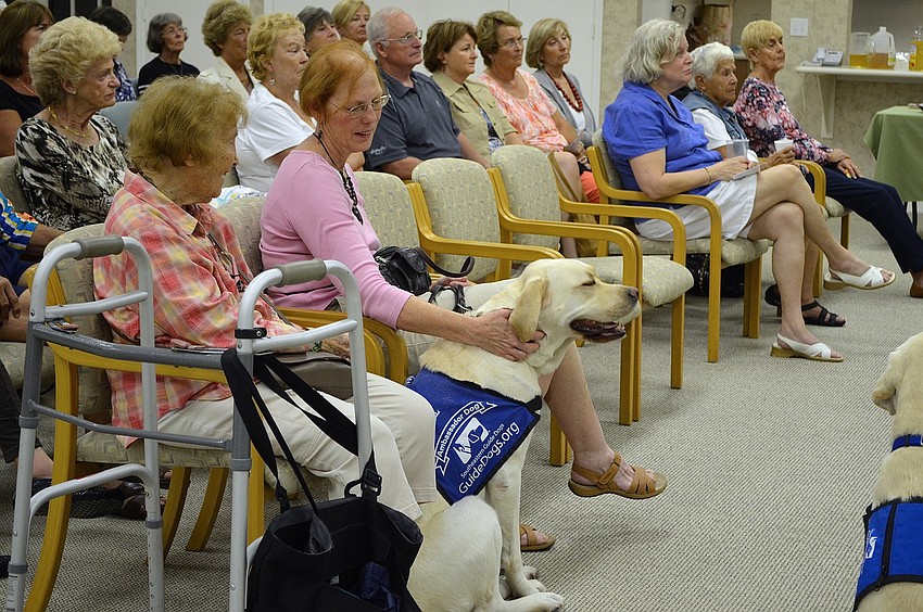 Millard sits with the audience