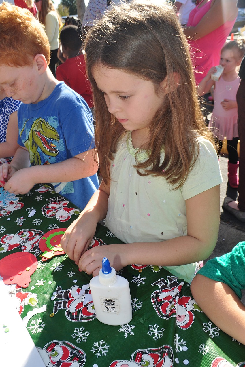 Charlotte Crowder, 6, makes an ornament alongside her brother, Elliot, not pictured.