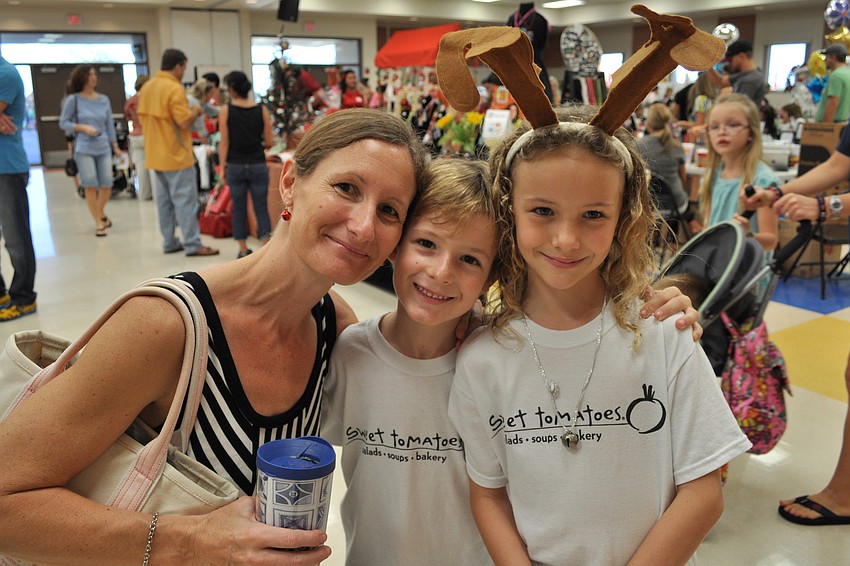 Laura, Cody and Casey Crawford visit the shopping area.