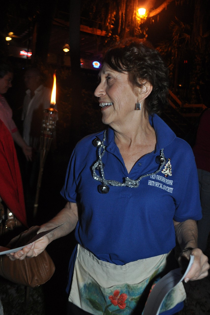 Yvonne Bedell passes out paper ballots for boat judging.