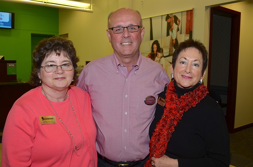 Sherie Becker, Larry Richards, Barbara Zdziarski say cheese.