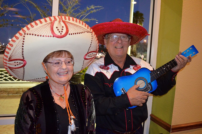 Sharon Shofstall and Clint Thiele play around before eating dinner.