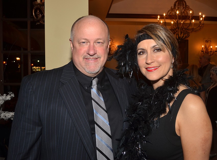 Ron and Dawn Allen show off matching black outfits.