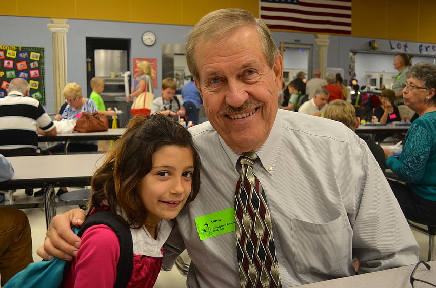 Lilly Aicher, 8, spend times with her grandfather, Bruce Lang.