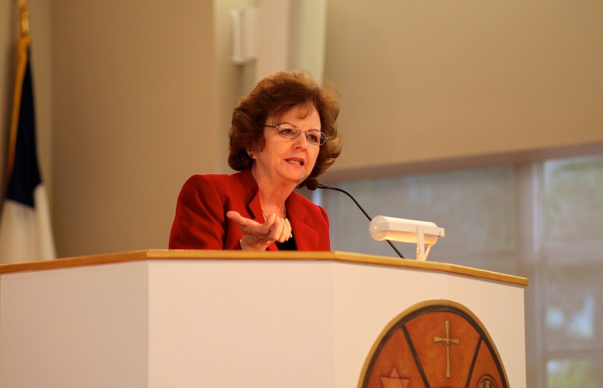 Donna Dunio tells the crowd about the Chapelâ€™s Aging in Paradise program.