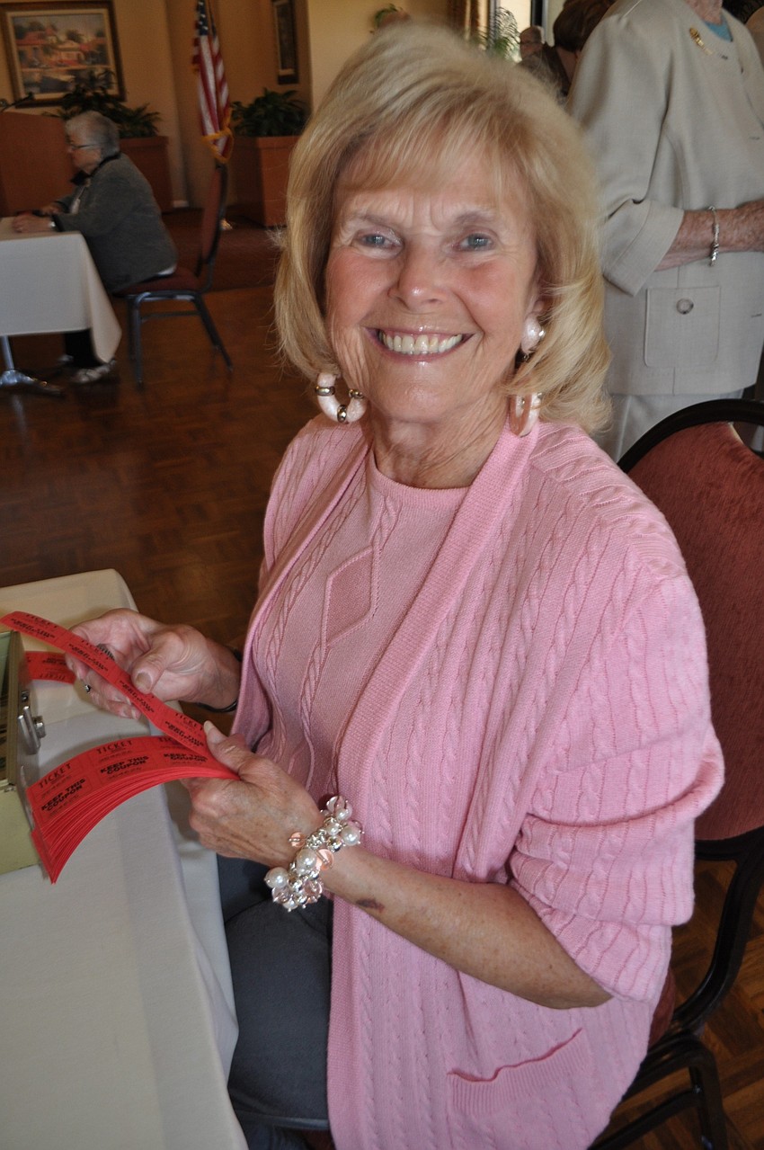 Beverly Allen sells raffle tickets.