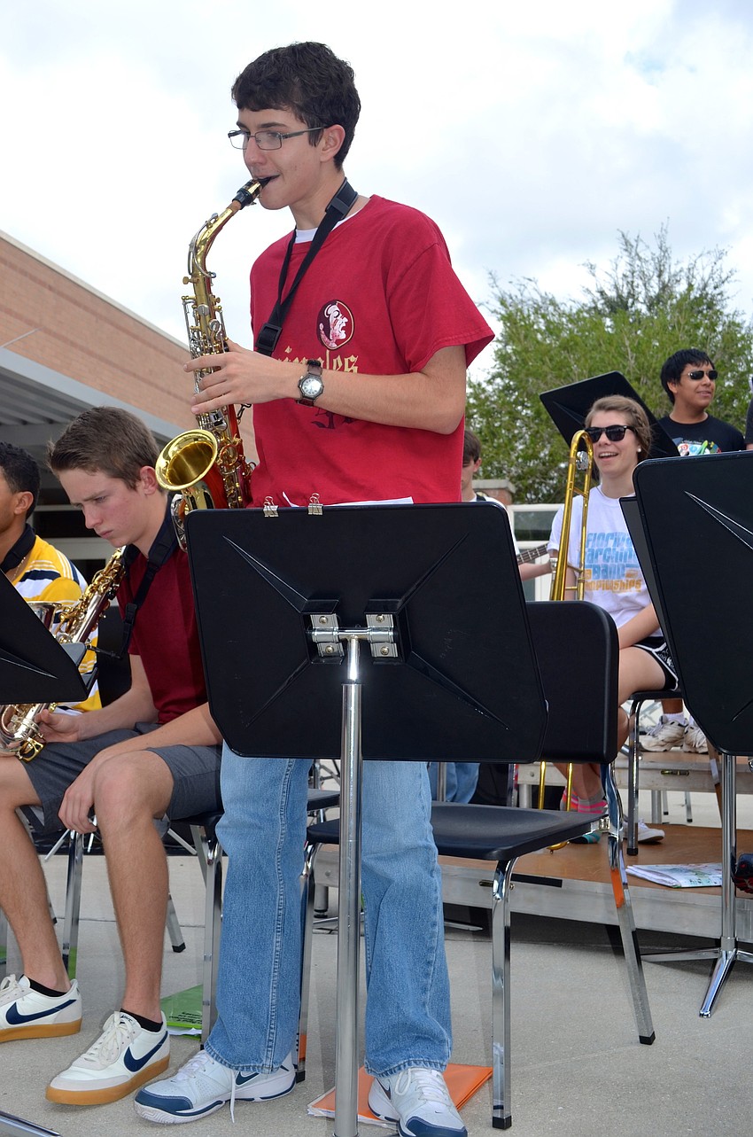 Sixteen-year-old Chris Medrano plays a solo on his saxophone.