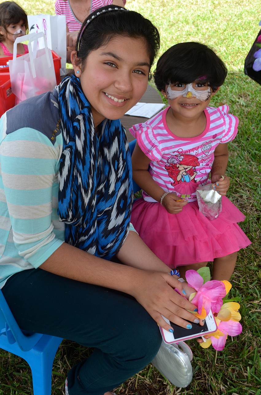 Sisters, Khushi Trivedi, 10, and Keya, 3, spend time together.