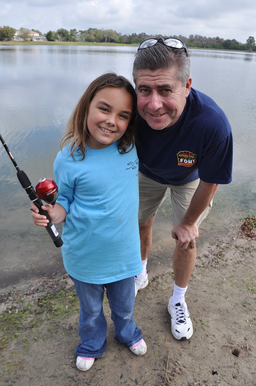 Emma O'Brien fishes with her dad, Jimmy.