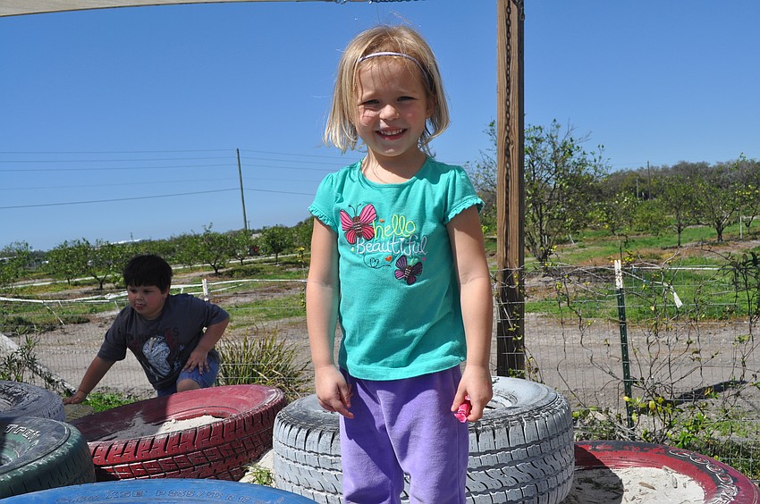 Cana Mims, 3, played on the tires.