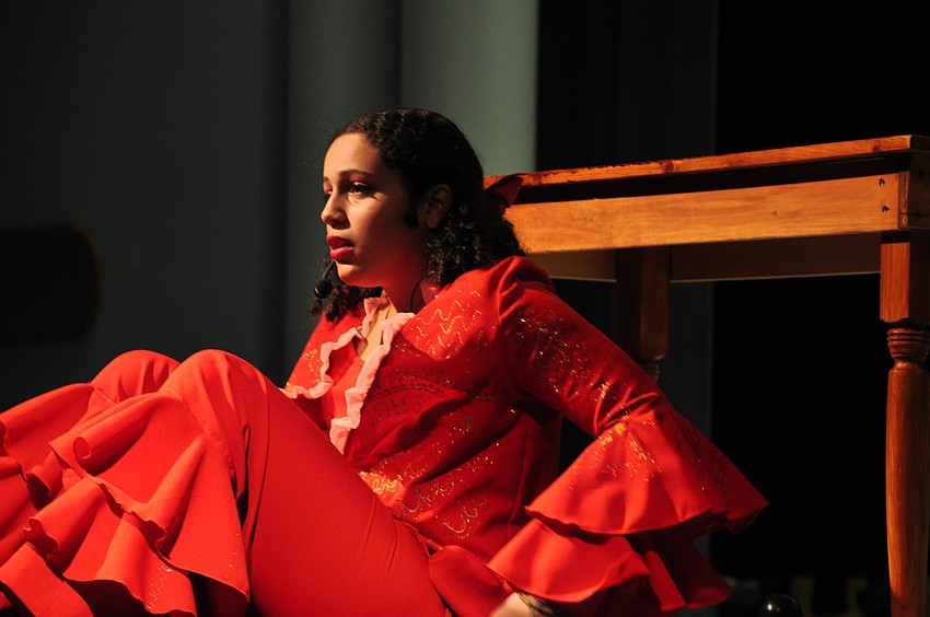 Sami Copeland, as Sebastian the crab, hides from a chef.