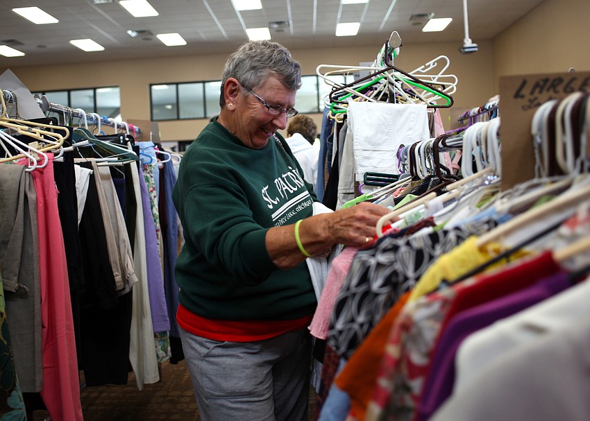 Stella Huebner looks through the womenâ€™s clothing section.