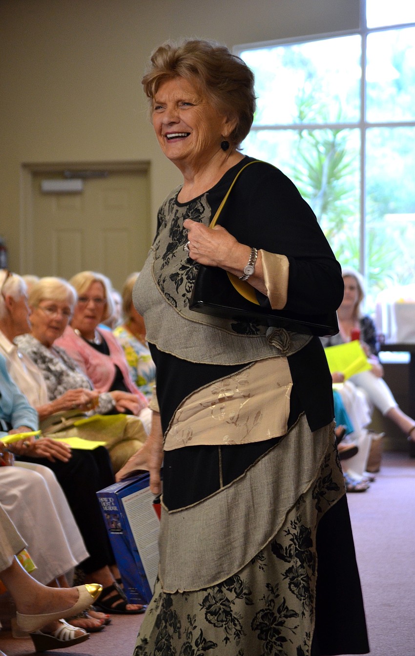 Martha Miller laughs at the commentary during her turn on the catwalk.