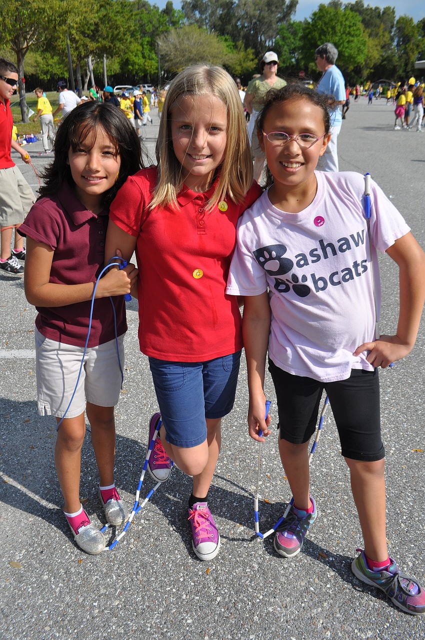 Ariana Perez, Brooke Price and Vianey Amezcua break from jumping.
