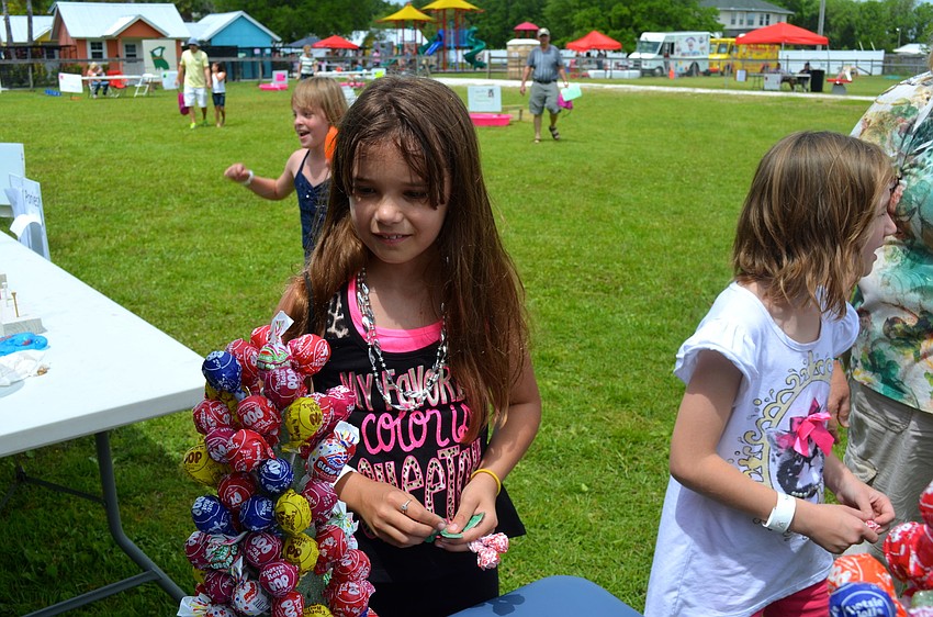Jennifer Laub, 10, decides which flavor of lollipop to choose.