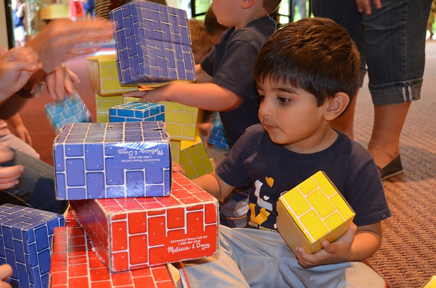 Arman Malik tries to build a pyramid.