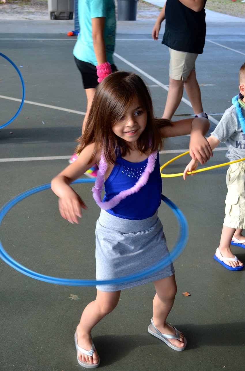 Sofia Borges competes in a hula hoop contest.