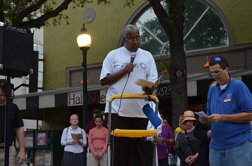 Sarasota County Commissioner Carolyn Mason reads at the first station.