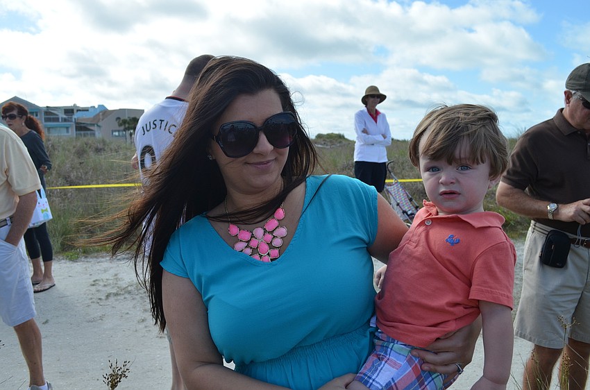 Alexia and Shain Eicher take a break from hunting eggs.