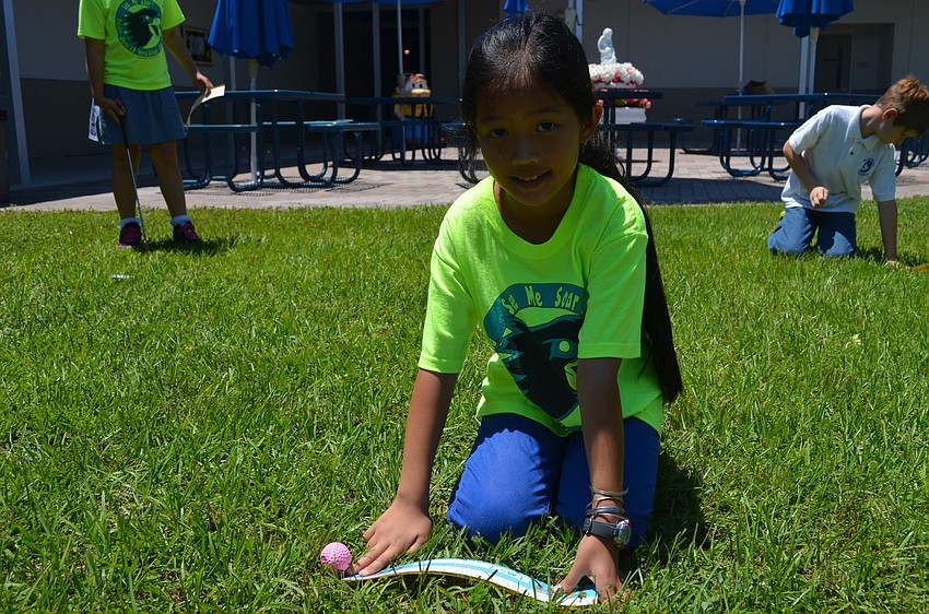 Hong Pham takes a break from measuring.