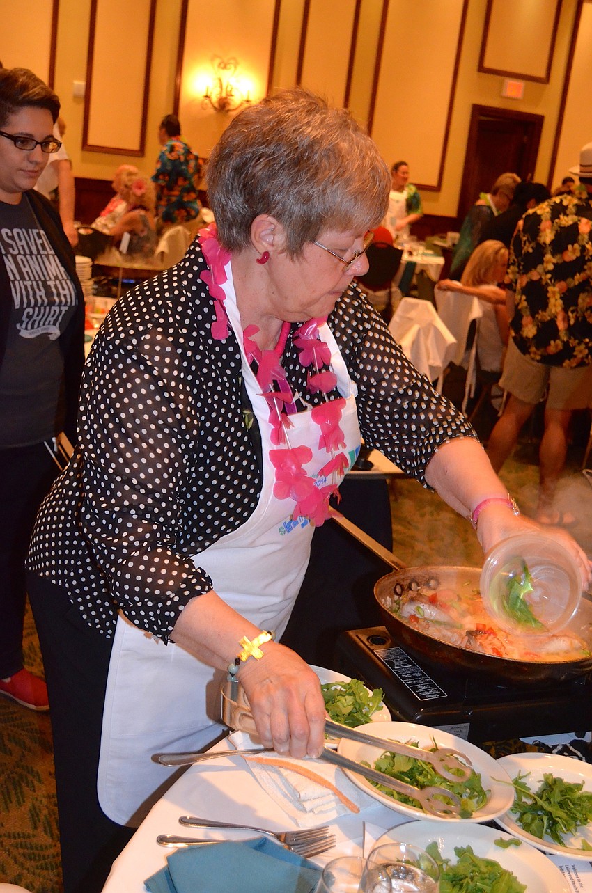 Jan Connor puts together a meal for the participants at her table.